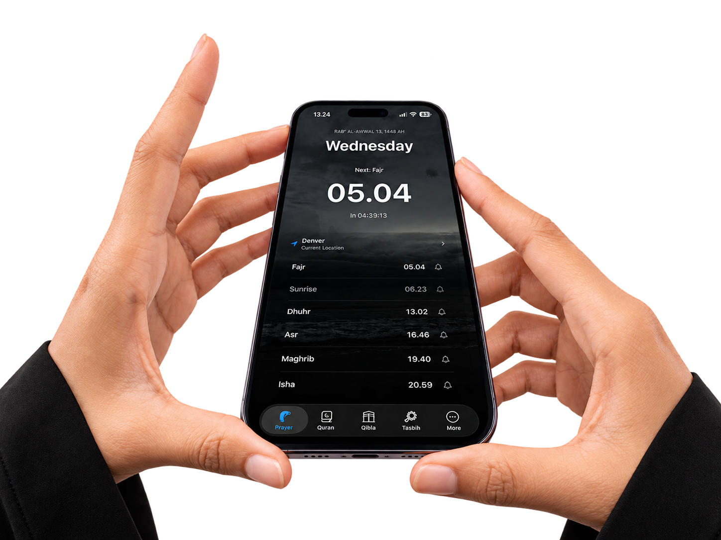 Hands holding a phone with Muslim Base prayer times and shortcuts to Quran, Qibla, and Tasbih
